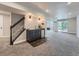 Finished basement with a wet bar, carpeted floor, and sliding doors leading to the outside at 19098 E Ida Dr, Aurora, CO 80015