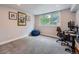 Finished bedroom with carpeted floor, a blue beanbag chair, and a desk and computer at 19098 E Ida Dr, Aurora, CO 80015