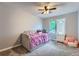 Bright bedroom with neutral decor, plush carpeting, and a ceiling fan at 19098 E Ida Dr, Aurora, CO 80015
