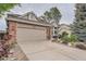 Inviting two-story home featuring a brick and siding exterior with lush landscaping at 19098 E Ida Dr, Aurora, CO 80015