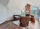 Bright living room with vaulted ceilings, large windows, a brick fireplace, and comfortable seating at 19098 E Ida Dr, Aurora, CO 80015