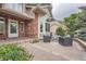 An inviting brick home featuring a charming patio area with stylish outdoor seating and ample space for entertaining at 19098 E Ida Dr, Aurora, CO 80015