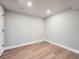 Unfurnished room with wood flooring, neutral walls, and recessed lighting at 19098 E Ida Dr, Aurora, CO 80015