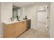Basement bar with a sink, a bar fridge, and ample storage at 2060 Eliot St, Denver, CO 80211