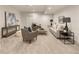 Spacious finished basement area with plush carpeting and cozy seating arrangement at 2060 Eliot St, Denver, CO 80211