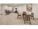 Finished basement area with lounge, dining, and bright lighting, perfect for Gathering activities at 2060 Eliot St, Denver, CO 80211