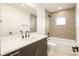 Modern bathroom features a stylish vanity, sleek fixtures, and a shower-tub combination at 2060 Eliot St, Denver, CO 80211
