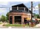 Exterior view of a brewery with patio umbrellas and outdoor seating at 2060 Eliot St, Denver, CO 80211