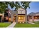 Charming two-story home boasting modern architecture and a well-manicured front yard at 2060 Eliot St, Denver, CO 80211