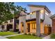 Modern two-story home with sleek architectural design and a neatly landscaped yard at 2060 Eliot St, Denver, CO 80211