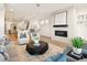Bright and airy living room with modern fireplace and open floor plan at 2060 Eliot St, Denver, CO 80211