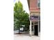 A restaurant's exterior with a 'Sexy Pizza' sign at 2060 Eliot St, Denver, CO 80211