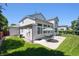 Backyard view with patio, seating, lawn and well maintained landscaping at 13362 Marion St, Thornton, CO 80241