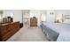 Inviting bedroom featuring warm wood furniture and a relaxing atmosphere at 13362 Marion St, Thornton, CO 80241