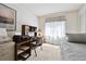 This is a functional bedroom with a desk, printer and a small daybed at 13362 Marion St, Thornton, CO 80241