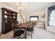 Charming dining room with wooden table and hutch, and adjacent living area at 13362 Marion St, Thornton, CO 80241