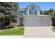 Charming two-story home boasts a three-car garage and well-maintained front yard at 13362 Marion St, Thornton, CO 80241