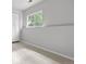 Bright bedroom with a large window for natural light and neutral walls at 204 Maple St, Frederick, CO 80530