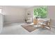 Bright living room features neutral decor, large windows, and comfortable seating at 204 Maple St, Frederick, CO 80530