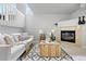 Stylish living area with a cozy fireplace, modern furnishings, and ample natural light at 204 Maple St, Frederick, CO 80530