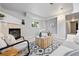 Bright living space with a fireplace, modern decor, and a cozy seating area near the entry way at 204 Maple St, Frederick, CO 80530