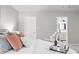 Bright main bedroom features neutral walls with decor, access to the bathroom, and plush bedding at 204 Maple St, Frederick, CO 80530
