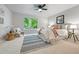 Cozy main bedroom with serene decor, large windows with green view, and comfortable seating at 204 Maple St, Frederick, CO 80530