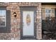 White front door with glass accents on stone exterior at 2935 W 81St Ave # H, Westminster, CO 80031