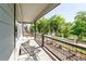 Covered back porch with serene water views and seating area at 3580 W 62Nd Pl, Denver, CO 80221