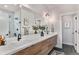 Modern bathroom with double vanity and walk-in shower at 3580 W 62Nd Pl, Denver, CO 80221