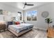 Bright bedroom with large windows and ceiling fan at 3580 W 62Nd Pl, Denver, CO 80221