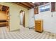 Unfinished basement with exposed ceiling, storage space, and utility hookups at 6882 Moore St, Arvada, CO 80004