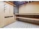 Unfinished basement storage area with open shelving and utility hookups at 6882 Moore St, Arvada, CO 80004