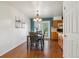 Charming dining room with wood table, chandelier, and access to the outdoor patio at 6882 Moore St, Arvada, CO 80004