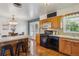 Cozy kitchen featuring dining area and access to outdoor patio via French doors at 6882 Moore St, Arvada, CO 80004