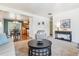 Open-concept living room with a dining area and kitchen beyond, plenty of natural light at 6882 Moore St, Arvada, CO 80004