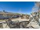 A large backyard with a concrete patio, lounge seating and workout equipment at 7310 Carnation Pl, Commerce City, CO 80022