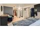 Bedroom features wood floors, a wardrobe, and doorway at 7310 Carnation Pl, Commerce City, CO 80022