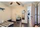A bedroom featuring wood floors, and a glimpse into the rest of the home at 7310 Carnation Pl, Commerce City, CO 80022