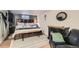 Large bedroom featuring a ceiling fan, and a decorative mirror and dresser at 7310 Carnation Pl, Commerce City, CO 80022