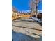 Fenced backyard showcasing a concrete patio and landscaping at 3120 N Race St, Denver, CO 80205