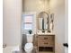 Clean bathroom with white subway tile and wood vanity at 3120 N Race St, Denver, CO 80205