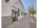 Front view of the Perseverance building featuring artistic doorway, gray/white color scheme, and bright exterior lighting at 3120 N Race St, Denver, CO 80205