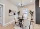 Cozy dining room featuring a modern chandelier and views of the outdoor space at 3120 N Race St, Denver, CO 80205