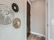 Bright hallway with modern wall decor and a wooden door at 3120 N Race St, Denver, CO 80205