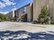 Denver Museum of Nature & Science entrance with large banners and ample parking at 3120 N Race St, Denver, CO 80205