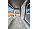 Spacious covered porch with durable tiled flooring and ample natural light at 3120 N Race St, Denver, CO 80205