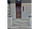 Inviting covered front porch with gray tile flooring and painted brick columns at 3120 N Race St, Denver, CO 80205