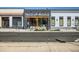 Street view of a TACO UP RISING restaurant featuring a black/gray color scheme, and inviting outdoor seating at 3120 N Race St, Denver, CO 80205