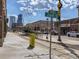 Urban street view featuring a modern train station, the 26th St sign, and a vibrant downtown skyline at 3120 N Race St, Denver, CO 80205